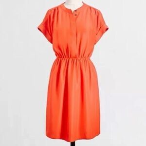J Crew Orange short sleeve dress with two front pockets & hidden buttons on top